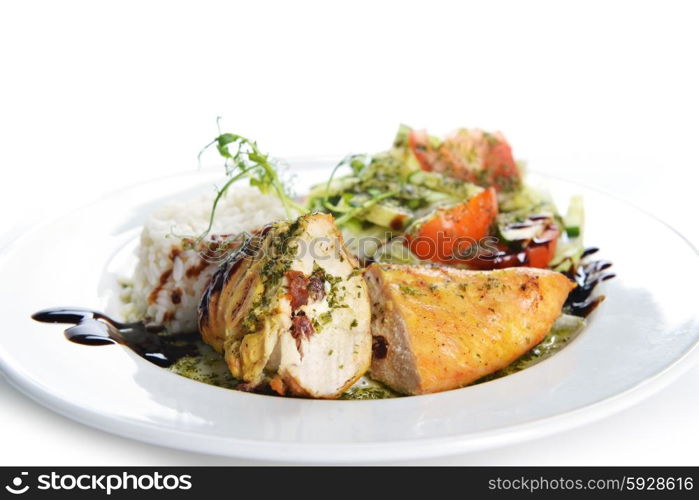 roasted chicken, rice and vegetables on dish