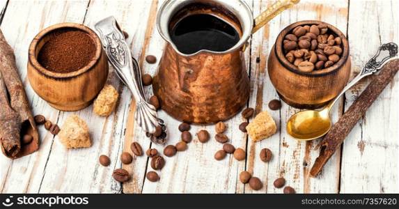 Roasted coffee beans and ground coffee.Coffee beans on wood background. Coffee beans and grounds