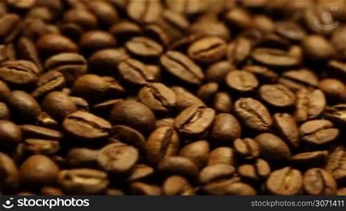 Roasted coffee beans background macro