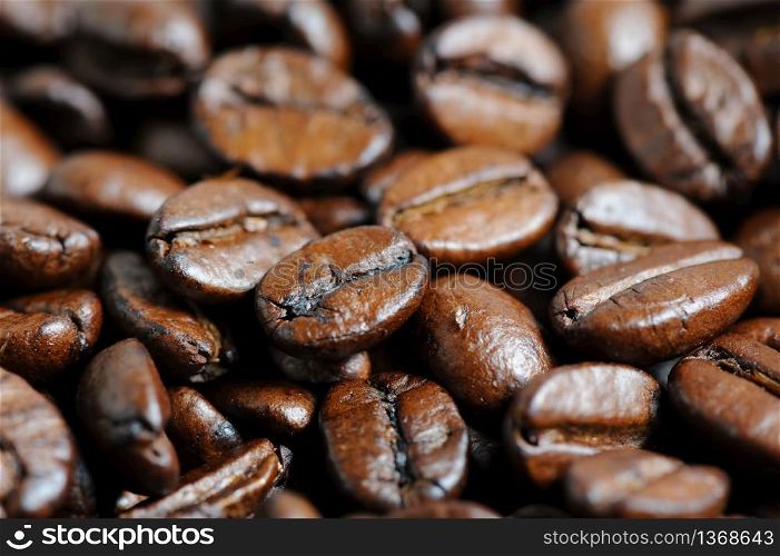 roasted coffee beans closeup background, selective focus. roasted coffee beans macro background