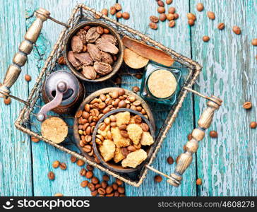 Roasted coffee beans. Coffee beans, cardamom, spices sugary in a stylish basket