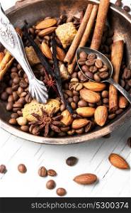 roasted coffee beans. Coffee beans in bowl with anise, cinnamon and almonds