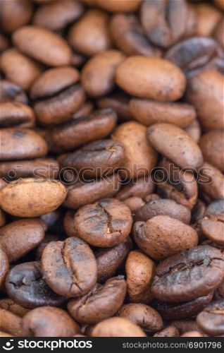 Roasted coffee beans extreme close-up, selective focus