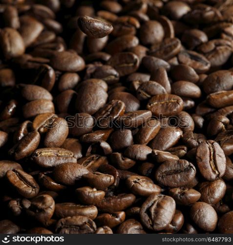 Roasted coffee beans. Fresh roasted coffee beans close-up background
