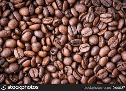 Roasted coffee beans texture background / Close up coffee bean top view
