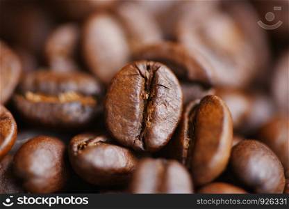 Roasted coffee beans texture background / Group of close up coffee beans macro