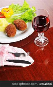 roasted cutlets of pork with potato and wine