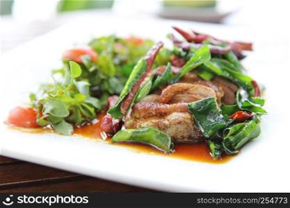 Roasted duck fillet with berry sauce and chilli