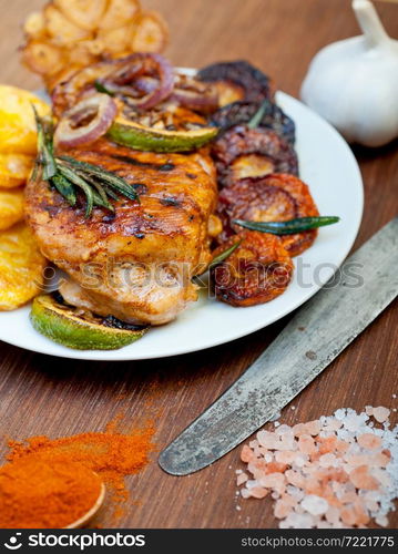 roasted grilled BBQ chicken breast with herbs and spices rustic style