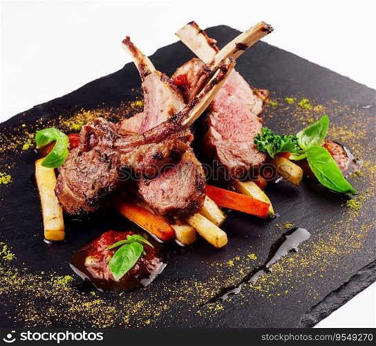 roasted lamb rack served with carrot, yellow curry and lamb sauce