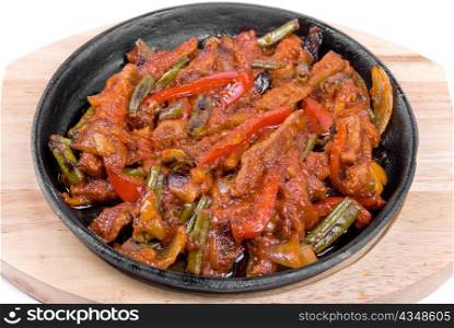 Roasted meat and vegetables at pan closeup