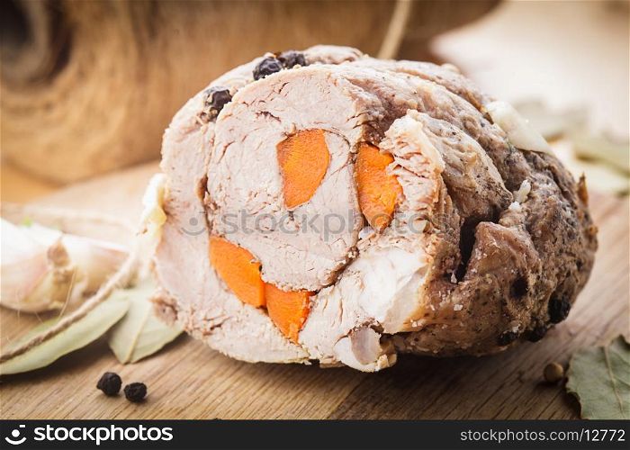 Roasted meat roll with carrot and spices