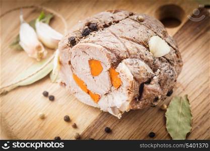 Roasted meat roll with carrot and spices