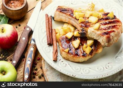 Roasted meat steak with caramelized apple.Autumn food. Delicious fried meat steak with apple