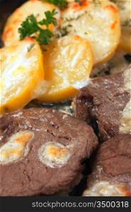 roasted meat with potatoes with sour cream