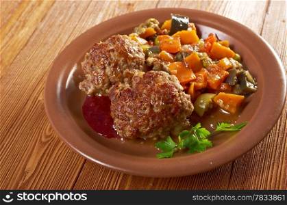 roasted meatballs beef with vegetables on a plate