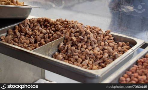 Roasted nuts being scooped up in New York City