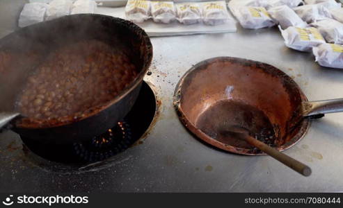 Roasted nuts being stirred