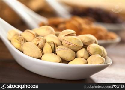Roasted pistachio nuts with shell (Selective Focus, Focus on the upper right pistachio)