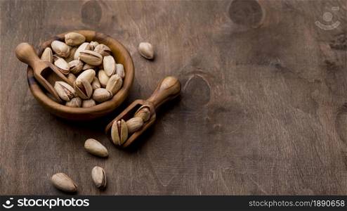 roasted pistachio nuts wooden table . Resolution and high quality beautiful photo. roasted pistachio nuts wooden table . High quality and resolution beautiful photo concept