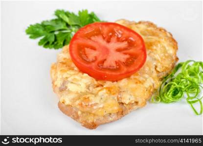 Roasted pork steak baked with cheese and tomato