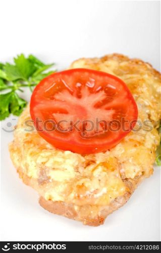 Roasted pork steak baked with cheese and tomato