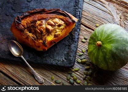 roasted pumpkin on vintage tray in wooden table background