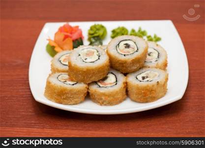Roasted roll with cream cheese, cucumber and salmon fish