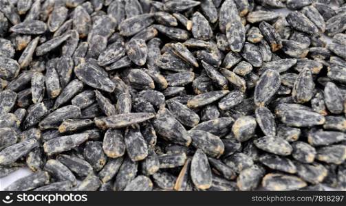 Roasted salted black sunflower seed background
