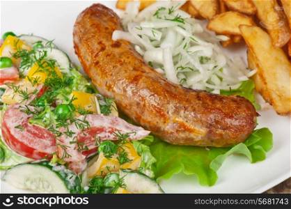 Roasted sausage with vegetables closeup