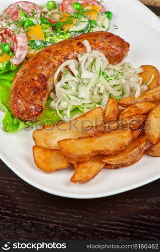 Roasted sausage with vegetables . Roasted sausage with vegetables closeup