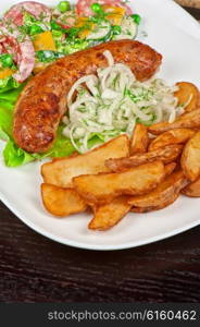 Roasted sausage with vegetables . Roasted sausage with vegetables closeup