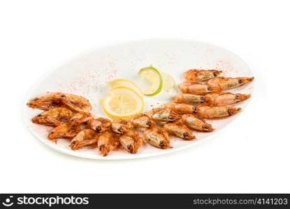 roasted shrimps with lemon isolated on a white background