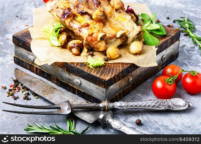 Roasted sliced pork. Piece of baked meat with mushrooms and spices.Delicious meat