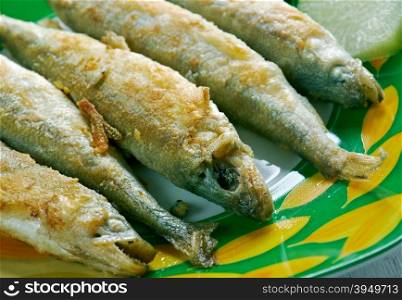Roasted smelt fish on a plate.close up