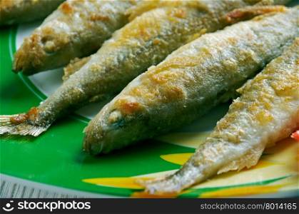 Roasted smelt fish on a plate.close up