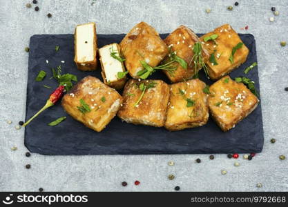 Roasted tofu cheese and sesame seeds,asian vegan food. Tahu Goreng. Tasty tofu cheese roasted with sesame