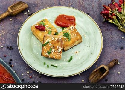 Roasted tofu cheese,asian vegan food. Homemade healthy vegetarian dishes. Tasty tofu cheese roasted with sesame