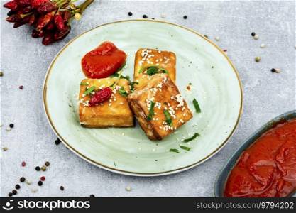 Roasted tofu cheese with sauce ,asian vegan food. Tasty tofu cheese roasted with sesame