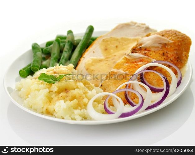 Roasted turkey slices with mashed potatoes and green beans