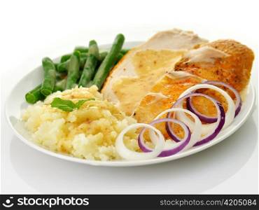 Roasted turkey slices with mashed potatoes and green beans