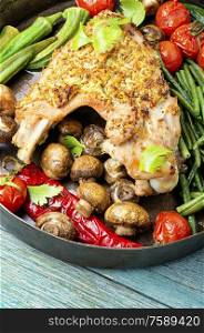 Roasted turkey with grilled vegetables on wooden table. Turkey with roasted vegetables.