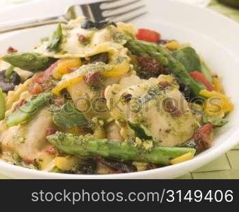 Roasted Vegetable Ravioli with Pesto Dressing Sun Blushed Tomatoes and Asparagus
