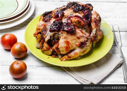 Roasted whole chicken. Lunch dish with roasted carcass of chicken in plum sauce