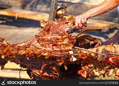 Roasting ox on a fire at a festival