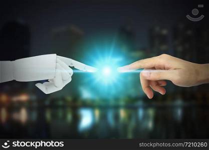Robot and human hands touching on city background, Artificial Intelligence Technology Concept