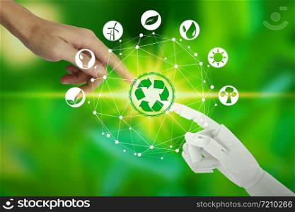 Robot and human hands with touching virtual environment icons over the network connection on nature background, Artificial Intelligence and Technology ecology concept