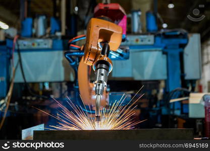 Robot is welding assembly automotive part in car factory