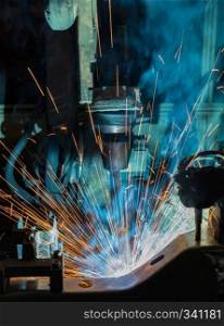 robot is welding in car factory