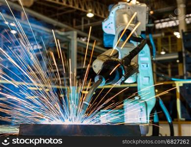 Robot is welding in factory